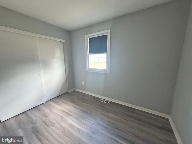 11 Centennial Ct, Sicklerville, NJ 08081 - unfurnished bedroom with wood finished floors, a closet, and baseboards