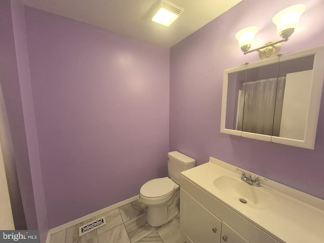 11 Centennial Ct, Sicklerville, NJ 08081 - bathroom with toilet, vanity, and baseboards