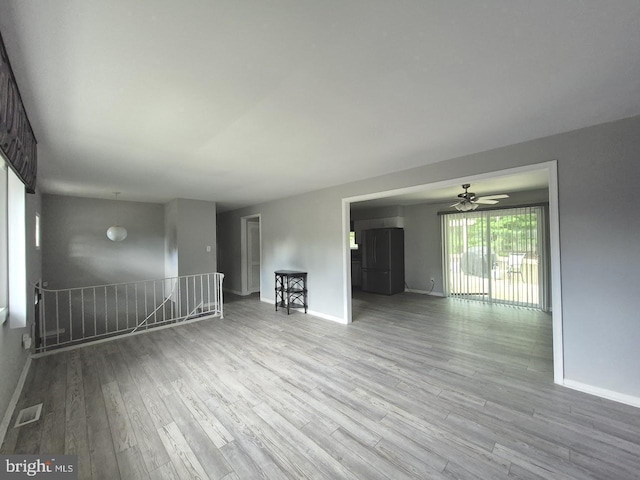 11 Centennial Ct, Sicklerville, NJ 08081 - unfurnished living room featuring baseboards, wood finished floors, and a ceiling fan