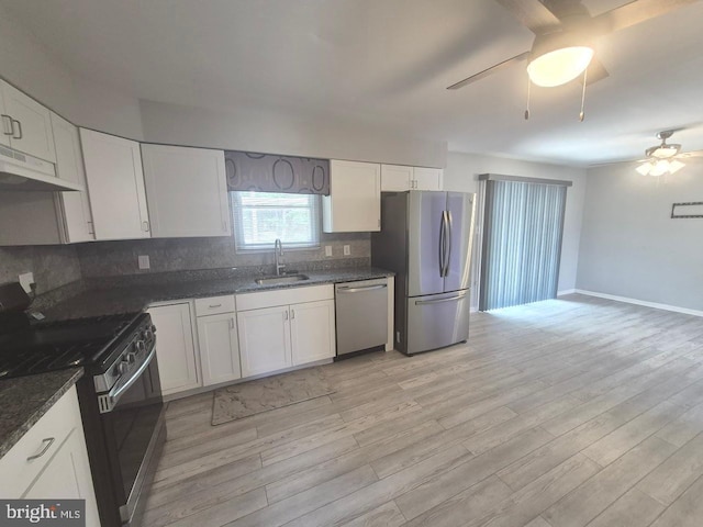 11 Centennial Ct, Sicklerville, NJ 08081 - kitchen with appliances with stainless steel finishes, under cabinet range hood, ceiling fan, a sink, and tasteful backsplash