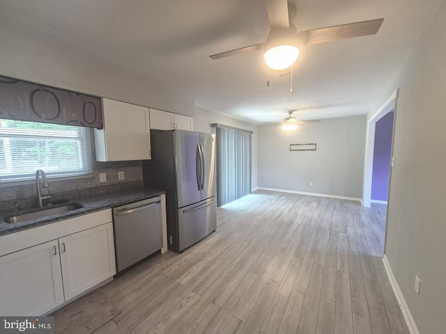 11 Centennial Ct, Sicklerville, NJ 08081 - kitchen with appliances with stainless steel finishes, a ceiling fan, a sink, and white cabinetry