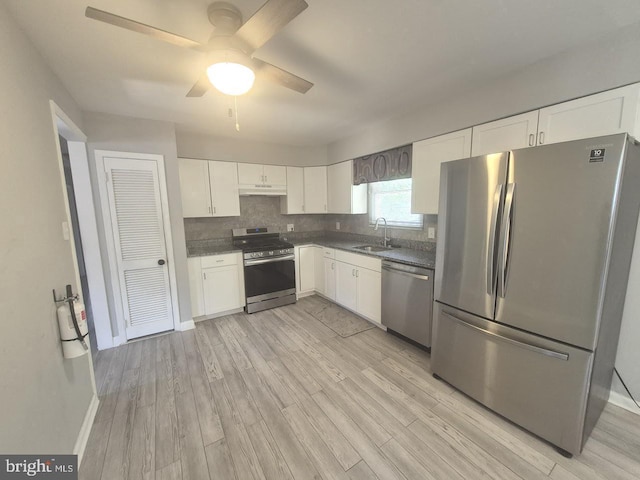 11 Centennial Ct, Sicklerville, NJ 08081 - kitchen with stainless steel appliances, a sink, white cabinets, and light wood-style flooring