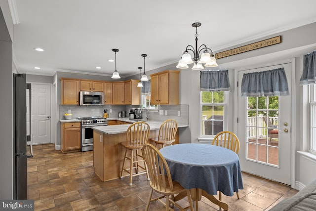 545 Lawrence Corner Rd, Pittsgrove, NJ 08318 - kitchen featuring appliances with stainless steel finishes, a peninsula, ornamental molding, light countertops, and a chandelier