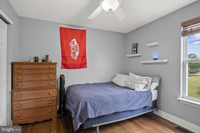 545 Lawrence Corner Rd, Pittsgrove, NJ 08318 - bedroom with hardwood / wood-style floors, a ceiling fan, baseboards, and a closet