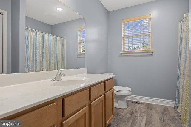 545 Lawrence Corner Rd, Pittsgrove, NJ 08318 - bathroom with vanity, toilet, wood finished floors, baseboards, and a shower with curtain