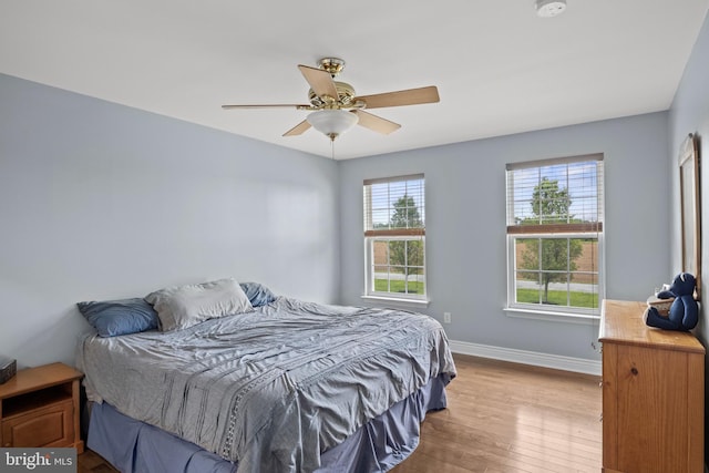545 Lawrence Corner Rd, Pittsgrove, NJ 08318 - bedroom with multiple windows, wood finished floors, baseboards, and a ceiling fan
