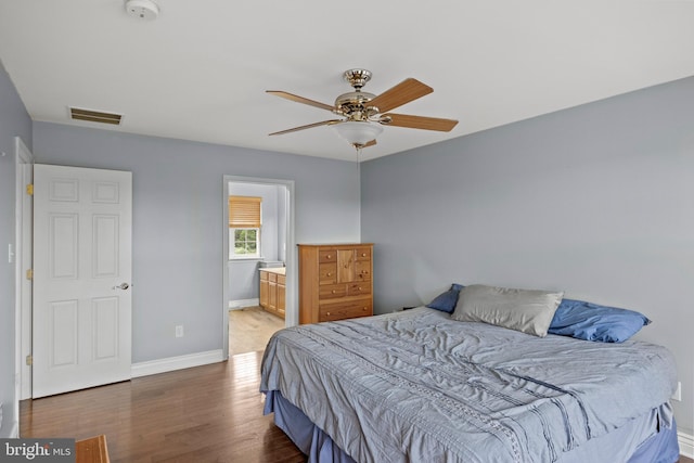 545 Lawrence Corner Rd, Pittsgrove, NJ 08318 - bedroom with wood finished floors, baseboards, ensuite bathroom, and ceiling fan