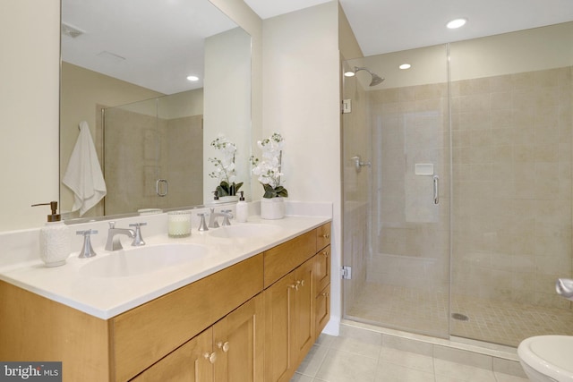 513 W Broad St Unit 602, Falls Church, VA 22046 - bathroom featuring a shower stall, tile patterned flooring, double vanity, toilet, and recessed lighting