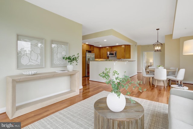 513 W Broad St Unit 602, Falls Church, VA 22046 - living area with light wood-style floors, baseboards, and recessed lighting