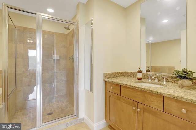 513 W Broad St Unit 602, Falls Church, VA 22046 - bathroom with vanity, a stall shower, recessed lighting, and baseboards