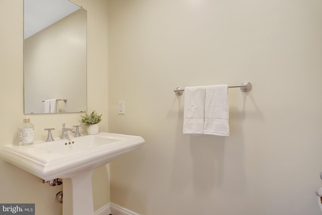 513 W Broad St Unit 602, Falls Church, VA 22046 - bathroom with a sink and baseboards