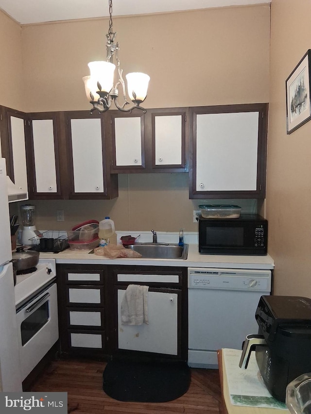 553 Centre Ave, Reading, PA 19601 - kitchen featuring white appliances, light countertops, a chandelier, and pendant lighting