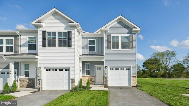 112 Pomo Ln, Winchester, VA 22602 - view of front facade featuring stone siding, a garage, a front yard, and a standing seam roof