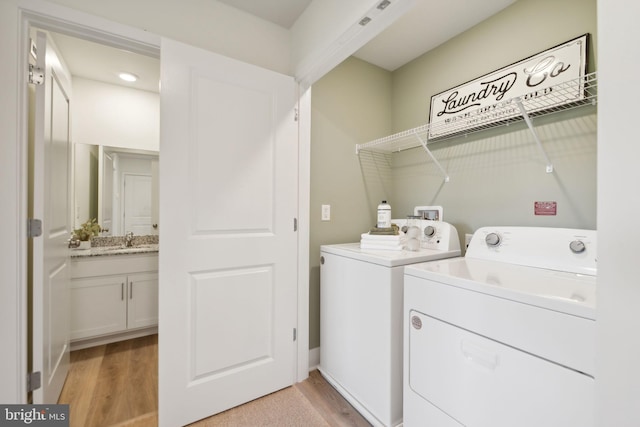112 Pomo Ln, Winchester, VA 22602 - washroom featuring washer and clothes dryer and light wood-style floors