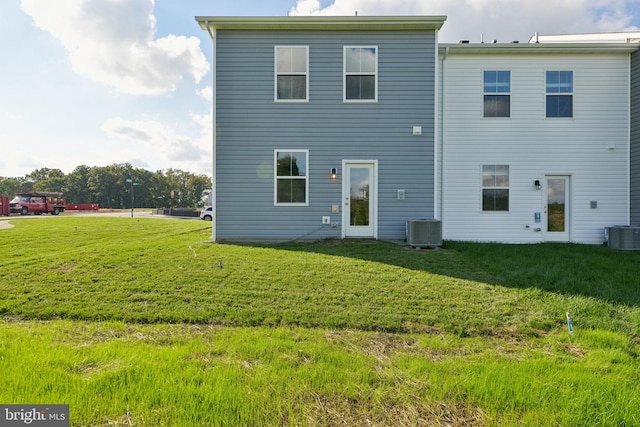 112 Pomo Ln, Winchester, VA 22602 - back of property with a lawn and central AC