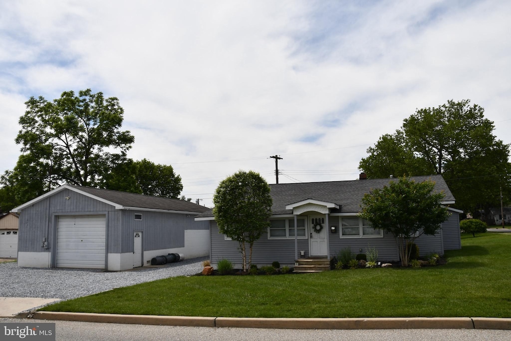 69 Walker Ave, Carneys Point, NJ 08069 - ranch-style home with a garage, a front lawn, an outbuilding, a shingled roof, and entry steps