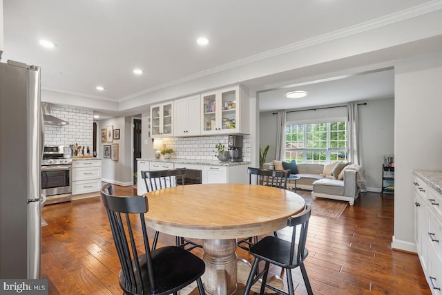 9977 Mallow Ct, Manassas, VA 20110 - dining space with dark wood finished floors, recessed lighting, ornamental molding, and baseboards