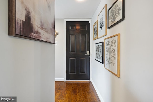9977 Mallow Ct, Manassas, VA 20110 - doorway with wood finished floors and baseboards
