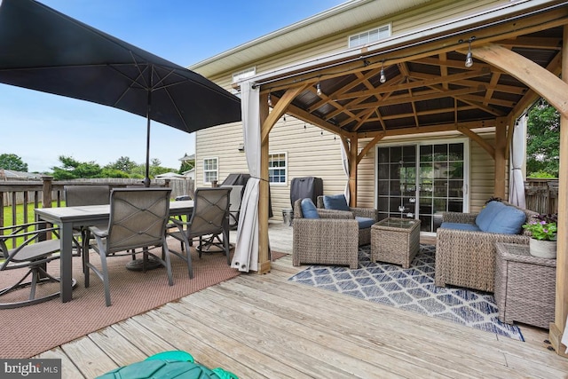 9977 Mallow Ct, Manassas, VA 20110 - wooden deck with a gazebo, outdoor dining space, and an outdoor living space