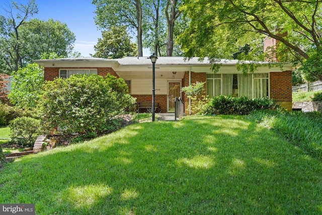 8008 Park Crest Dr, Silver Spring, MD 20910 - back of property featuring brick siding and a yard