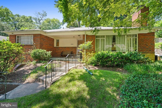 8008 Park Crest Dr, Silver Spring, MD 20910 - ranch-style home with brick siding, a chimney, and a front yard