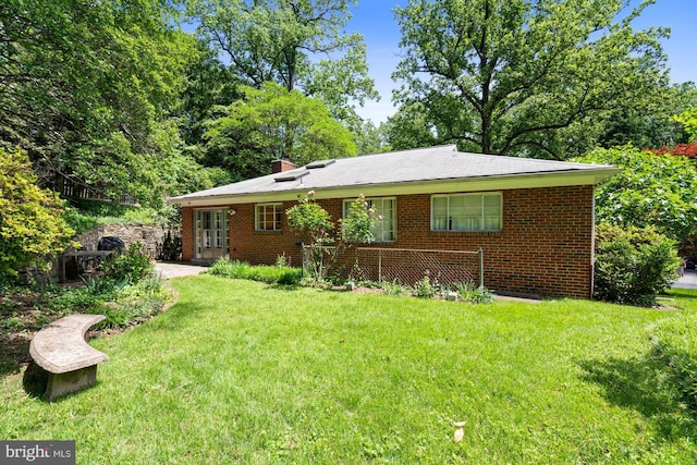 8008 Park Crest Dr, Silver Spring, MD 20910 - view of front of property with a front yard, brick siding, and a patio area