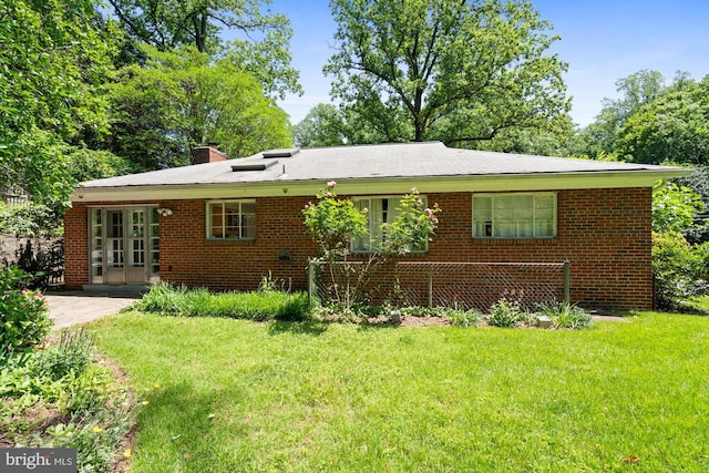 8008 Park Crest Dr, Silver Spring, MD 20910 - view of front of property featuring a front yard, a chimney, and brick siding