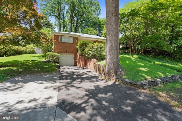 8008 Park Crest Dr, Silver Spring, MD 20910 - view of front of property featuring brick siding, driveway, a front yard, and a garage