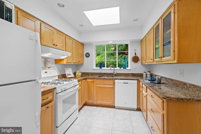 8008 Park Crest Dr, Silver Spring, MD 20910 - kitchen with white appliances, under cabinet range hood, a skylight, glass insert cabinets, and light tile patterned floors