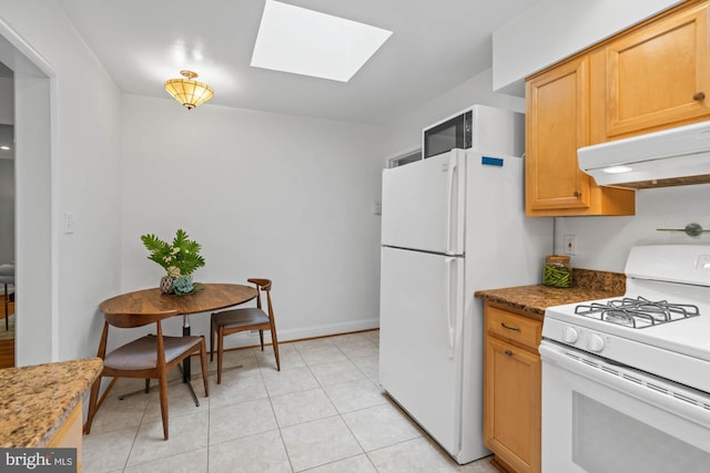 8008 Park Crest Dr, Silver Spring, MD 20910 - kitchen with white appliances, range hood, a skylight, and light tile patterned floors