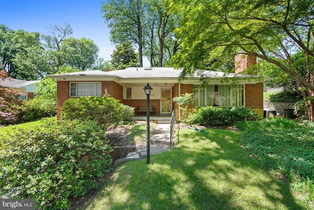 8008 Park Crest Dr, Silver Spring, MD 20910 - view of front of property featuring brick siding, a front lawn, and a chimney