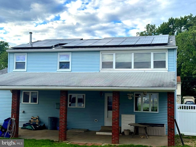 1202 Noreen Dr, Burlington, NJ 08016 - view of front facade featuring a patio area, roof mounted solar panels, and a ceiling fan