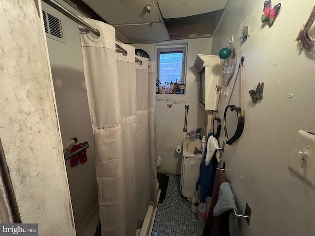 3833 Wyalusing Ave, Philadelphia, PA 19104 - full bath with tile patterned flooring, curtained shower, and toilet