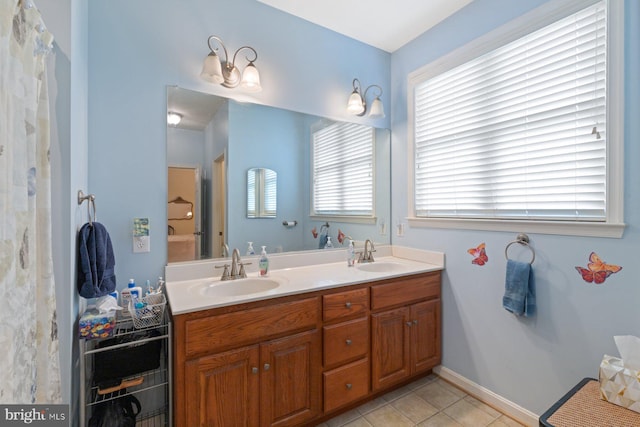5353 Walkerwood Ct, Manchester, MD 21102 - bathroom with double vanity, tile patterned flooring, and baseboards