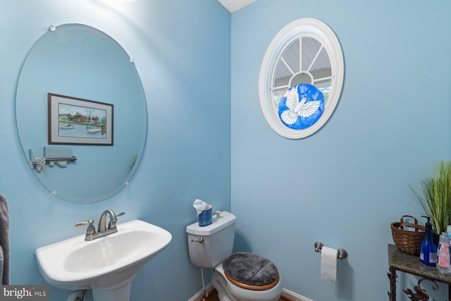 5353 Walkerwood Ct, Manchester, MD 21102 - half bath featuring a sink, toilet, and baseboards