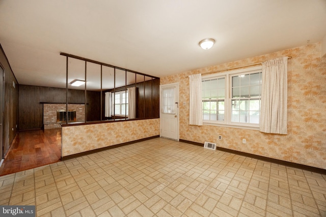 2256 Georgetown Dr, Malvern, PA 19355 - unfurnished living room featuring brick patterned flooring, wallpapered walls, and baseboards