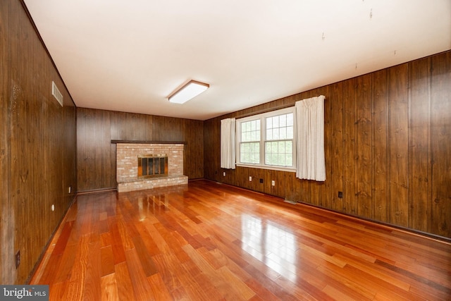 2256 Georgetown Dr, Malvern, PA 19355 - unfurnished living room with wood finished floors, wood walls, and a fireplace