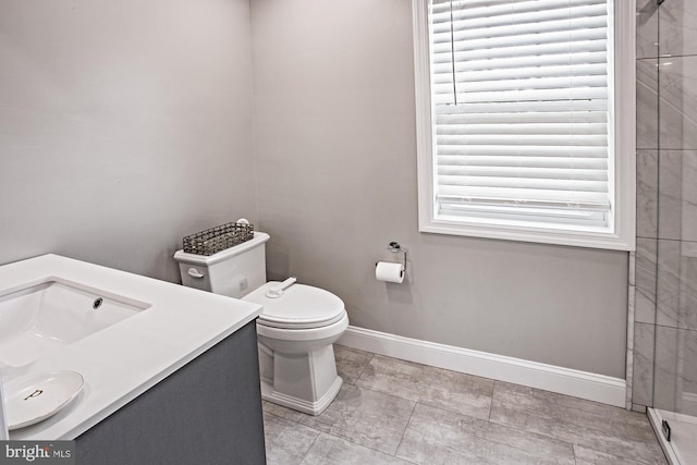 5000 Ogletown Stanton Rd, Newark, DE 19713 - full bathroom featuring baseboards, vanity, toilet, and a tile shower