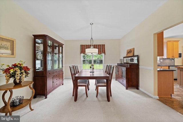 42 Manassas Dr, Middletown, DE 19709 - dining area featuring light carpet, baseboards, and vaulted ceiling