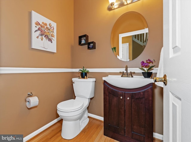 42 Manassas Dr, Middletown, DE 19709 - bathroom with toilet, vanity, wood finished floors, and baseboards