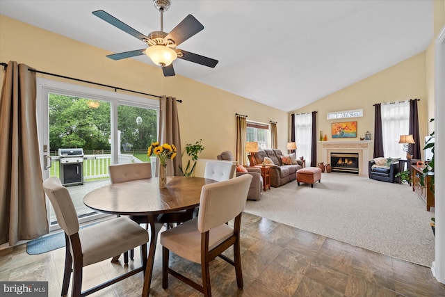 42 Manassas Dr, Middletown, DE 19709 - dining area featuring lofted ceiling, a ceiling fan, and a fireplace with flush hearth