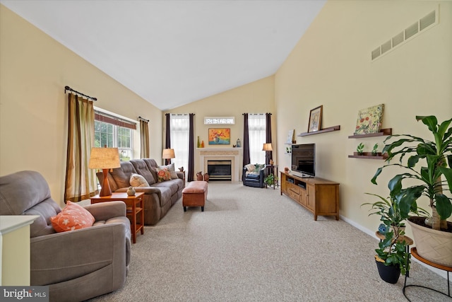 42 Manassas Dr, Middletown, DE 19709 - carpeted living room with high vaulted ceiling, a glass covered fireplace, and baseboards