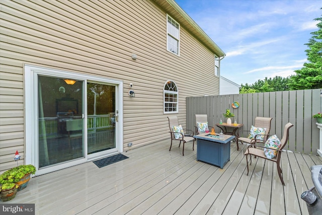 42 Manassas Dr, Middletown, DE 19709 - wooden deck featuring a fire pit