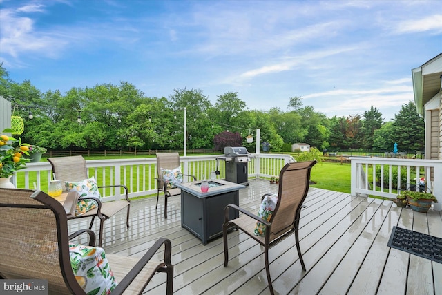 42 Manassas Dr, Middletown, DE 19709 - deck featuring area for grilling, a fire pit, and view of scattered trees