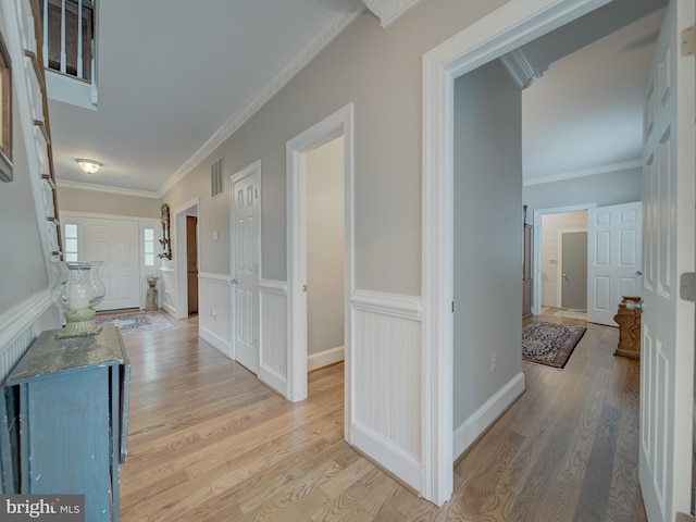 4387 Stepney Dr, Gainesville, VA 20155 - hallway featuring light wood finished floors and ornamental molding