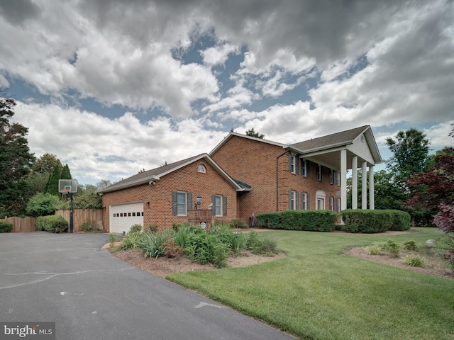 4387 Stepney Dr, Gainesville, VA 20155 - view of front facade featuring driveway, brick siding, and an attached garage