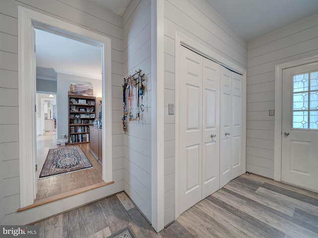 4387 Stepney Dr, Gainesville, VA 20155 - foyer entrance with wood finished floors, wooden walls, and crown molding