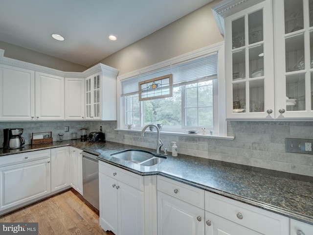 4387 Stepney Dr, Gainesville, VA 20155 - kitchen featuring a sink, stainless steel dishwasher, white cabinets, light wood finished floors, and decorative backsplash
