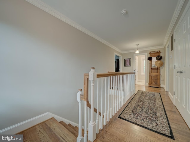 4387 Stepney Dr, Gainesville, VA 20155 - hall featuring light wood-style flooring, baseboards, an upstairs landing, and ornamental molding