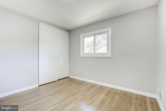 11830 Charles Rd, Silver Spring, MD 20906 - empty room with baseboards and light wood-type flooring